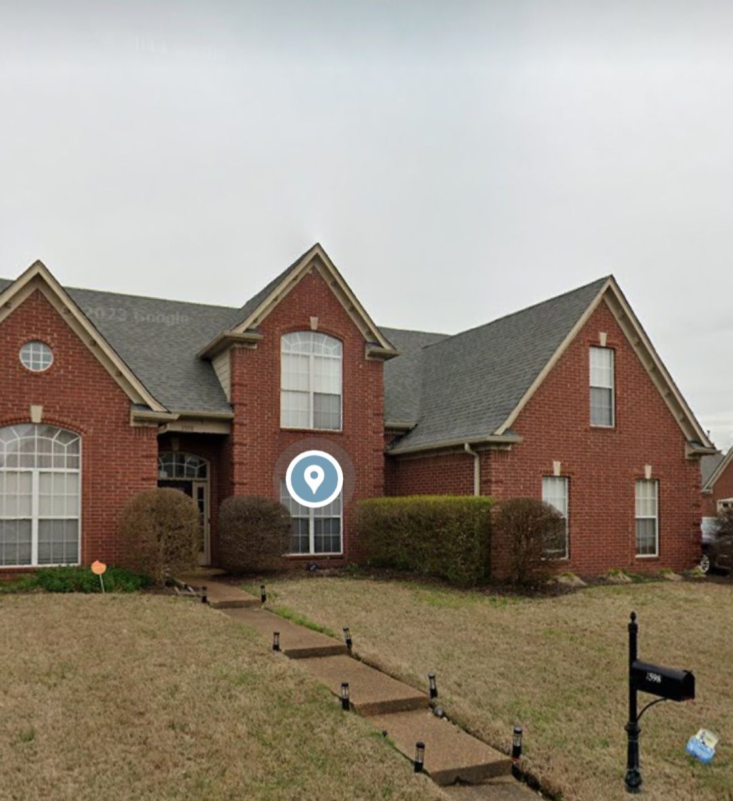 Red brick house in Memphis before being repainted