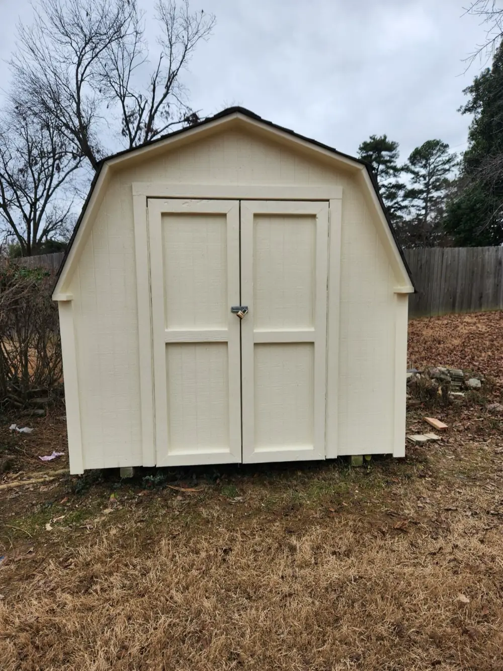 The same shed finished in cream exterior paint with clean trim lines